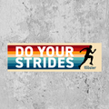 Sticker with 'Do Your Strides' text and a running silhouette on a concrete background