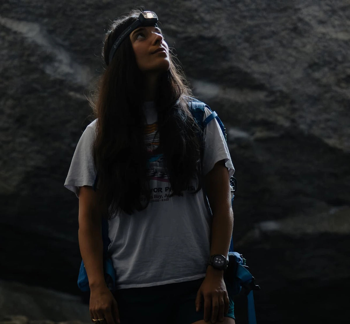 Woman rock climbing wearing a Coros Nomad Watch. 